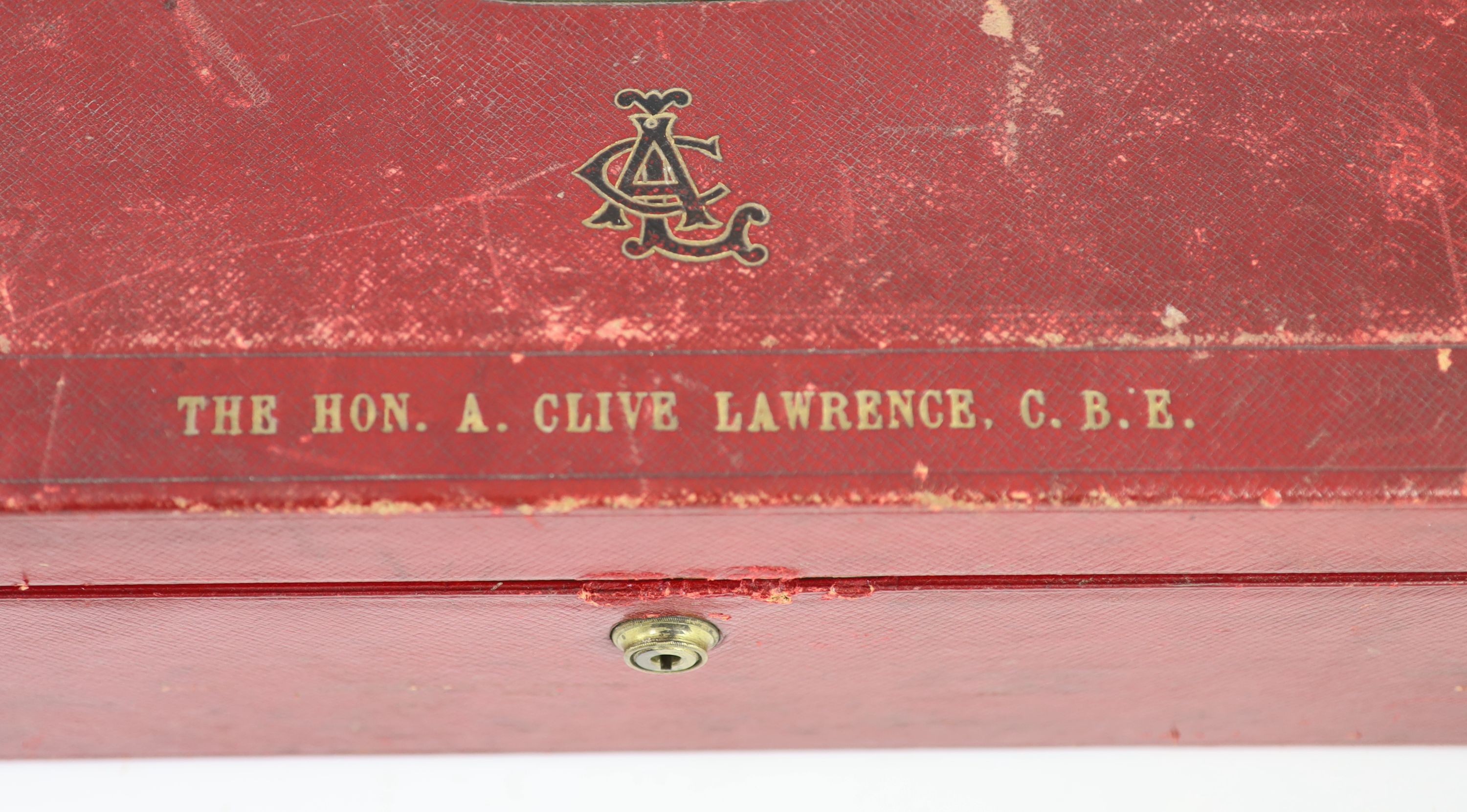 A red leather Morocco leather dispatch box 'The Hon A. Clive Lawrence C.B.E.' by John Peck & Son, Nelson Square, Blackfriars, 46 cm wide